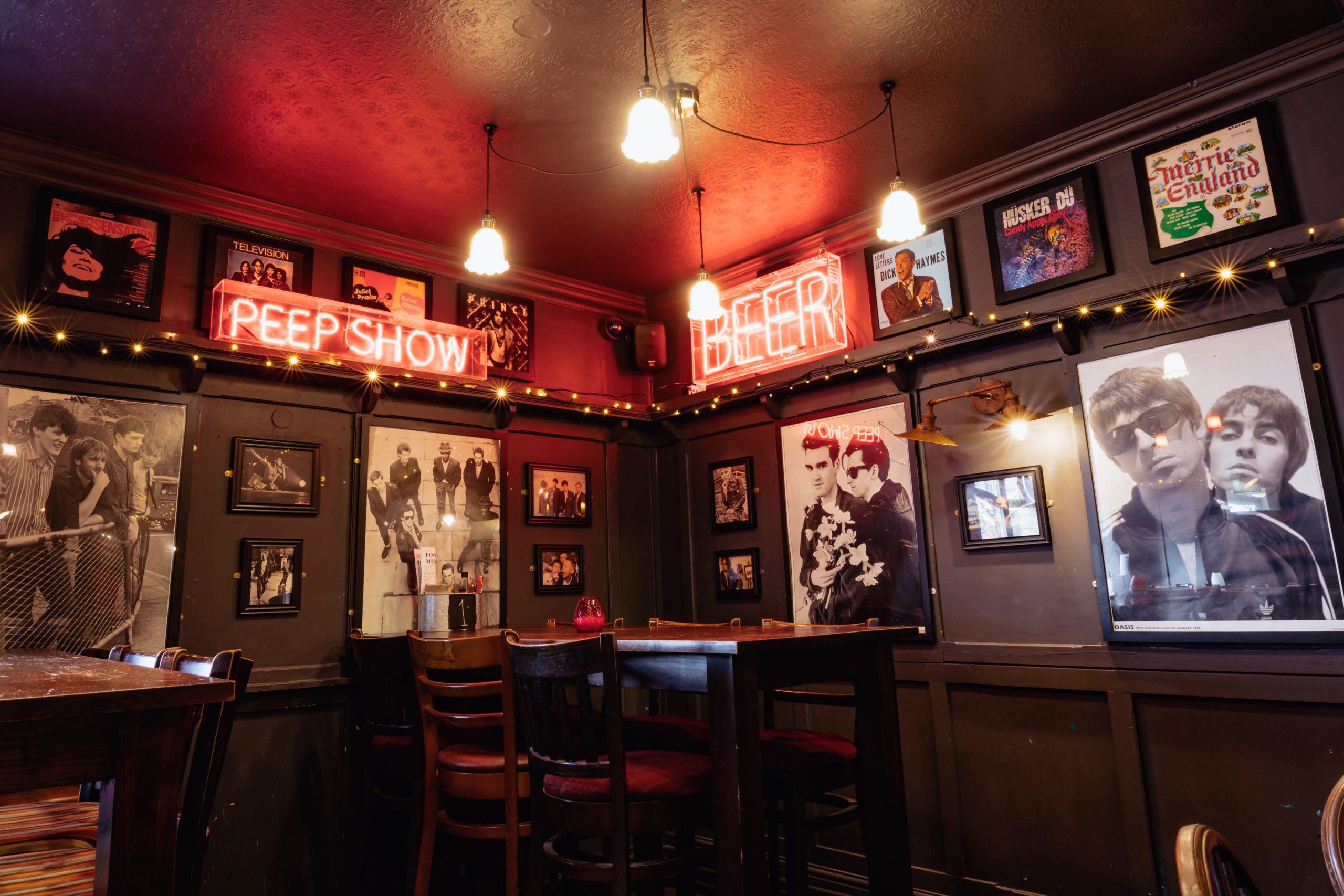 Music artwork and neon signs at at the bar