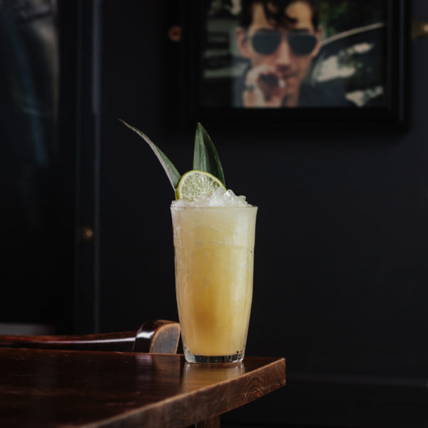 Zombie cocktail at The Old Grindstone with lemon and bamboo leaf garnish