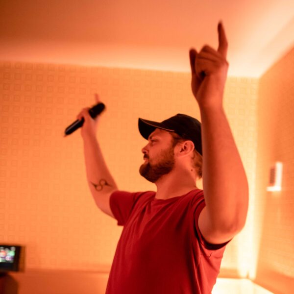 Person having fun singing in the karaoke rooms