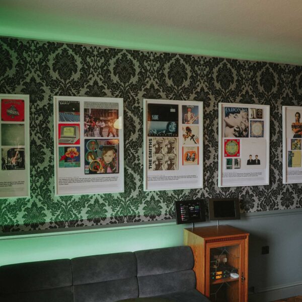 1980s inspired interior with vinyl and cassette album artwork display pieces