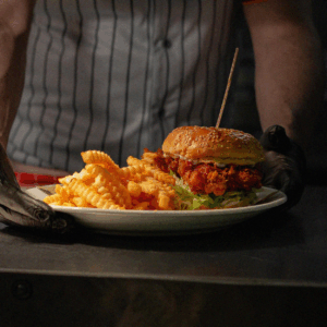 Food offers. Close-up of a freshly cooked chicken burger, representing a popular main from Hefty Hen included in True North food offers